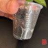 Close-up of Hoya plant root in small clear pot, showing healthy soil and root growth.